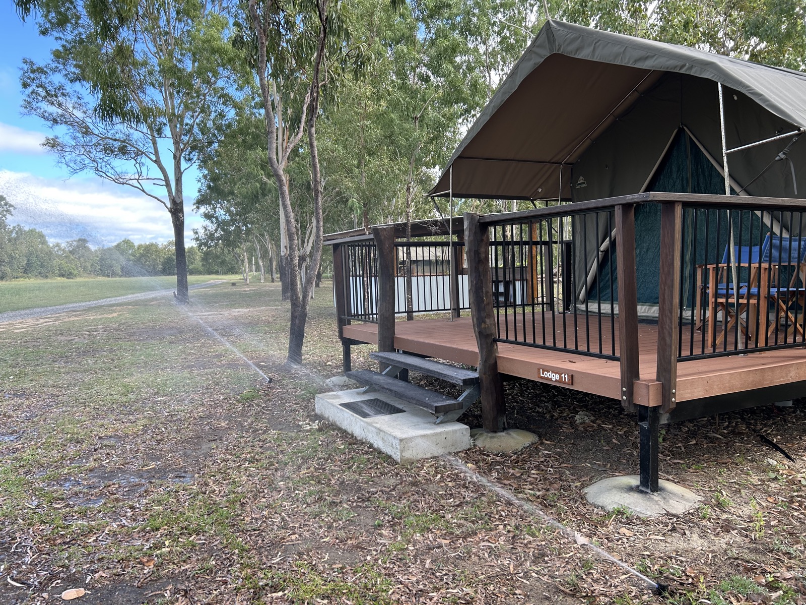 Finished remote lodge with timber deck in eucalyptus bush